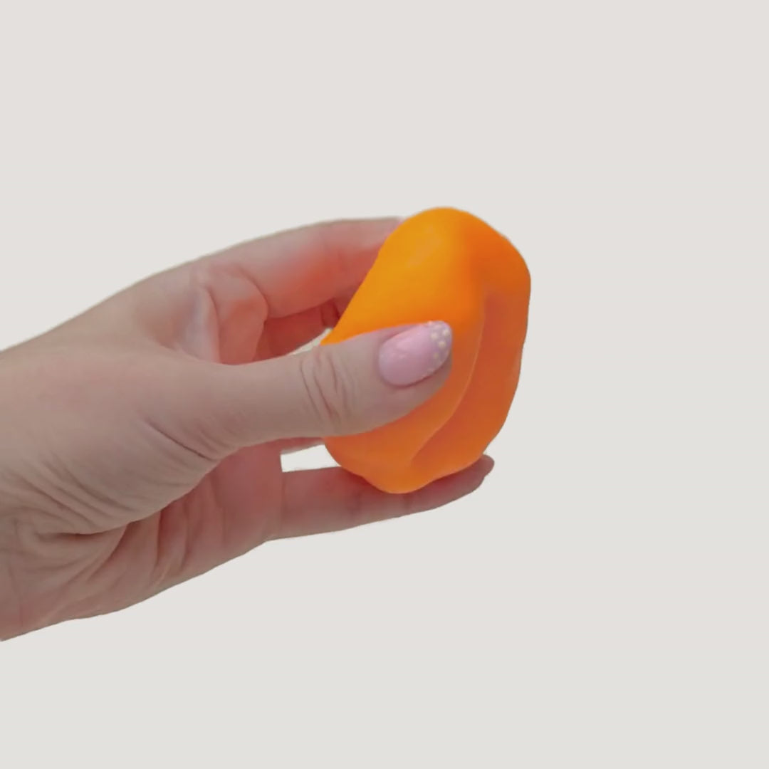 Stretchable sand-filled sensory fidget showing moving texture inside, designed for tactile input and calming sensory support.