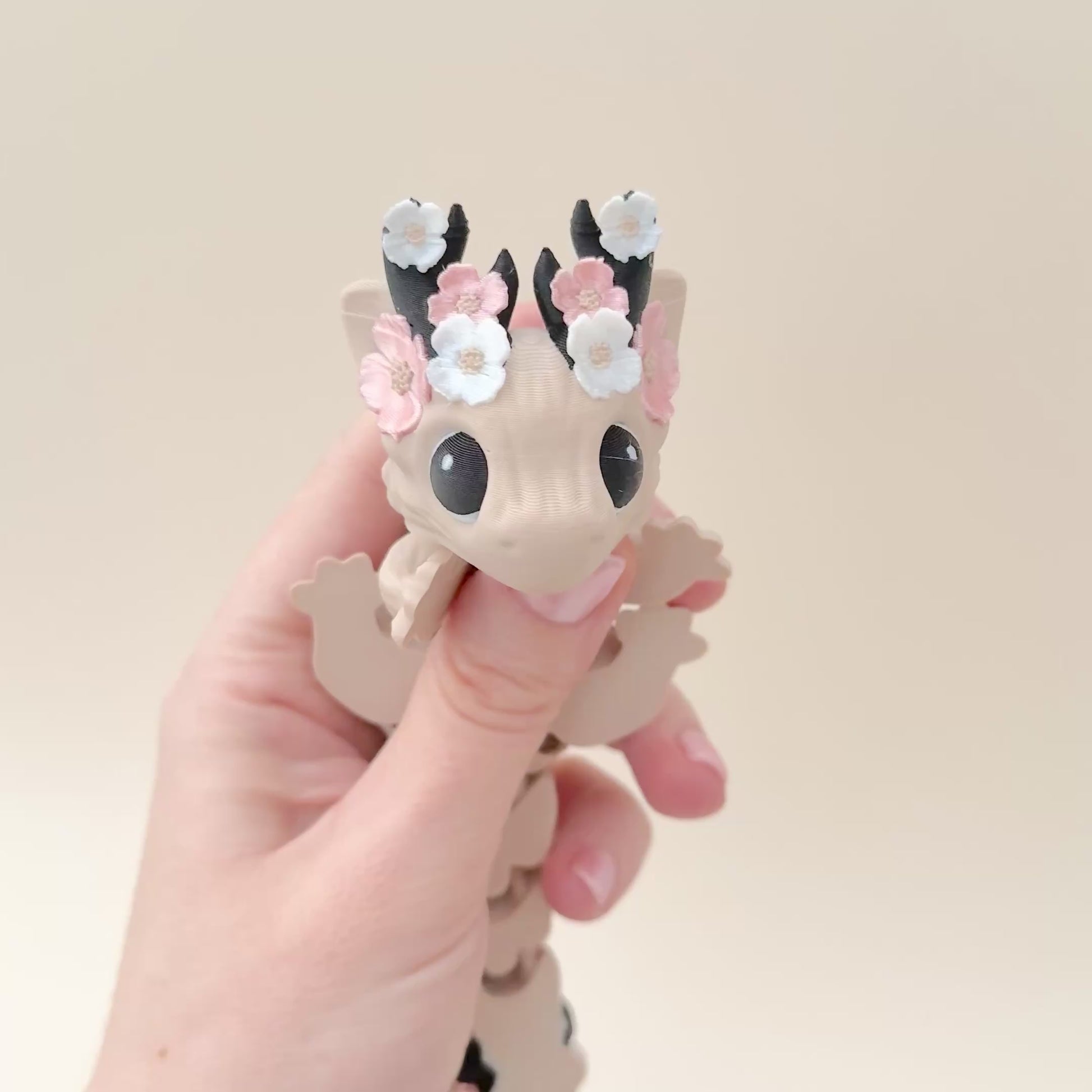 A flower-themed Floralyn Dragon with intricate details and flexible features, ideal for fidgeting and display.