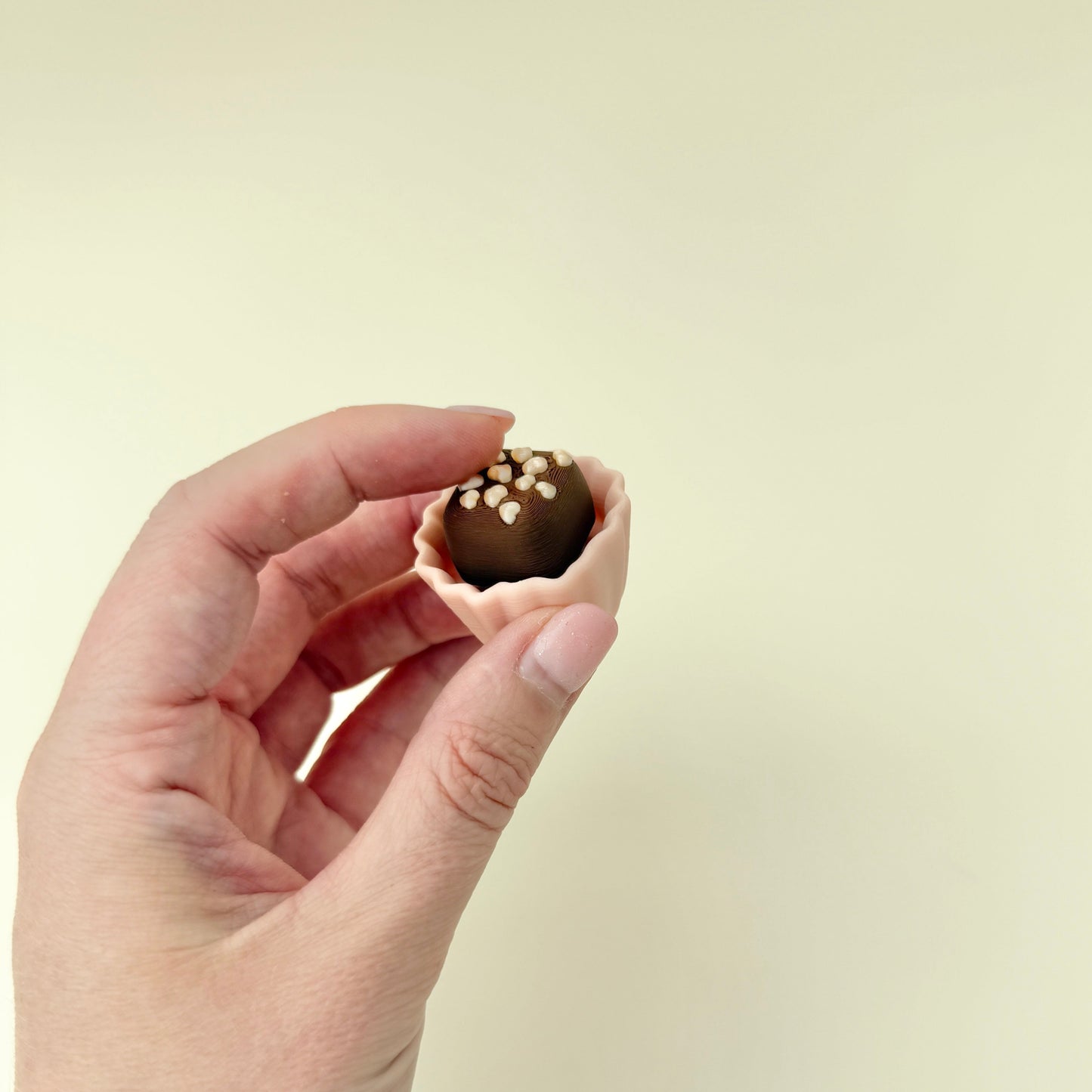 a novelty sensory tool shaped like chocolate with mixed touchpoints for fidgeting
