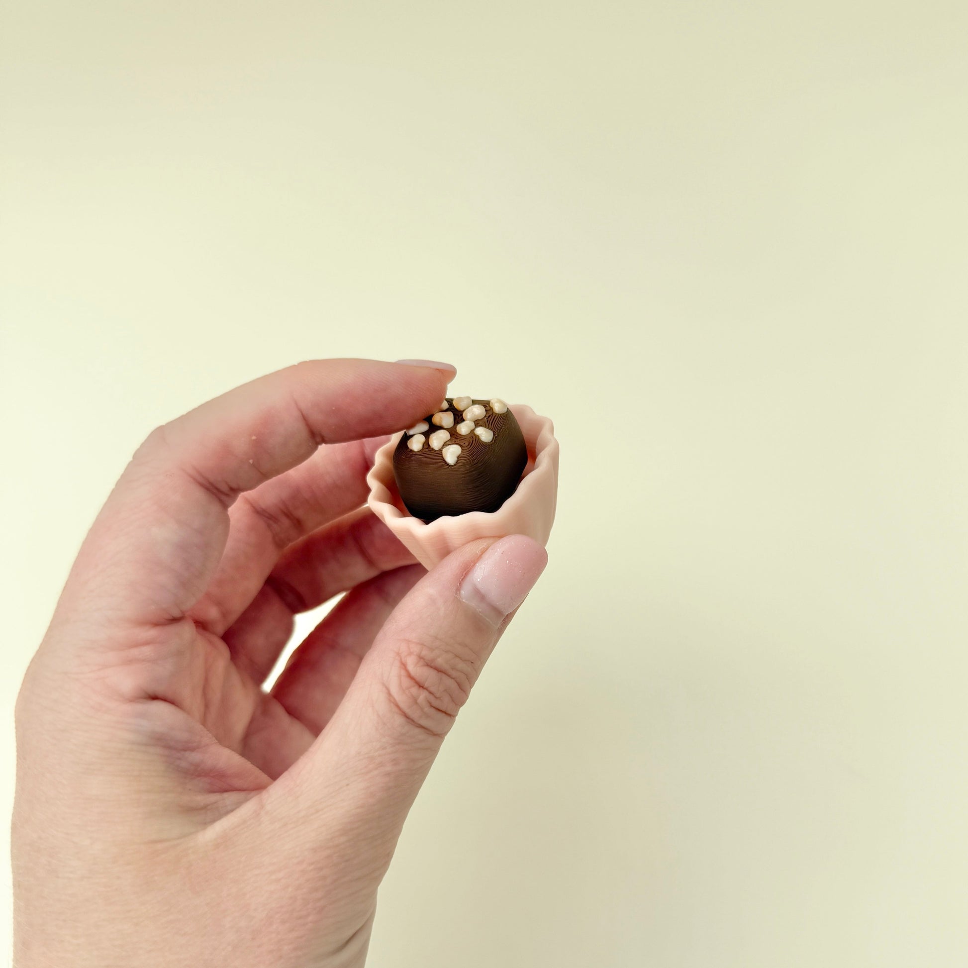 a novelty sensory tool shaped like chocolate with mixed touchpoints for fidgeting
